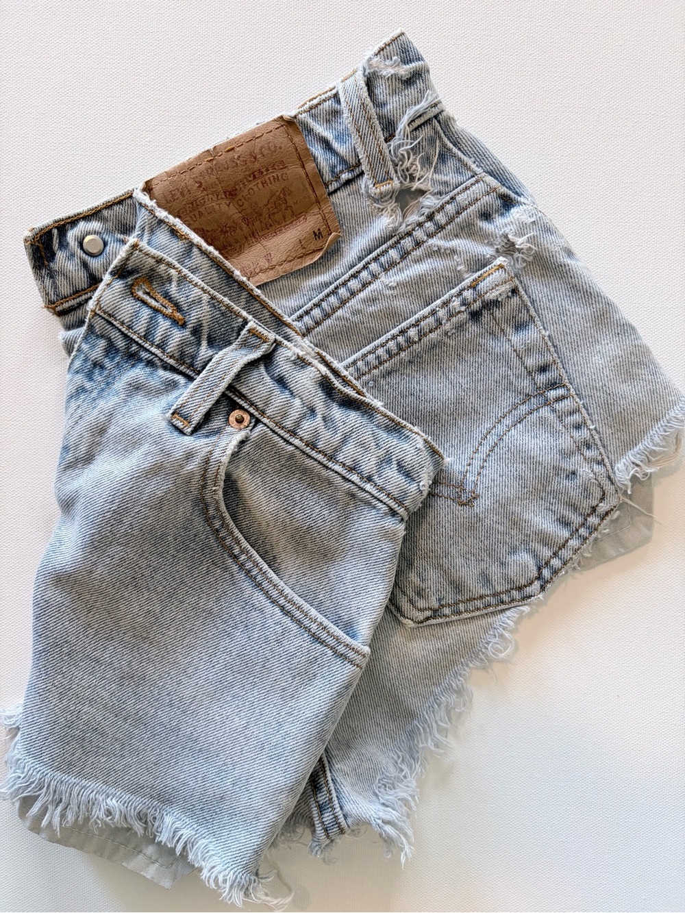Vintage 90s Levi's 551 Light Blue Distressed Denim Cutoff Shorts